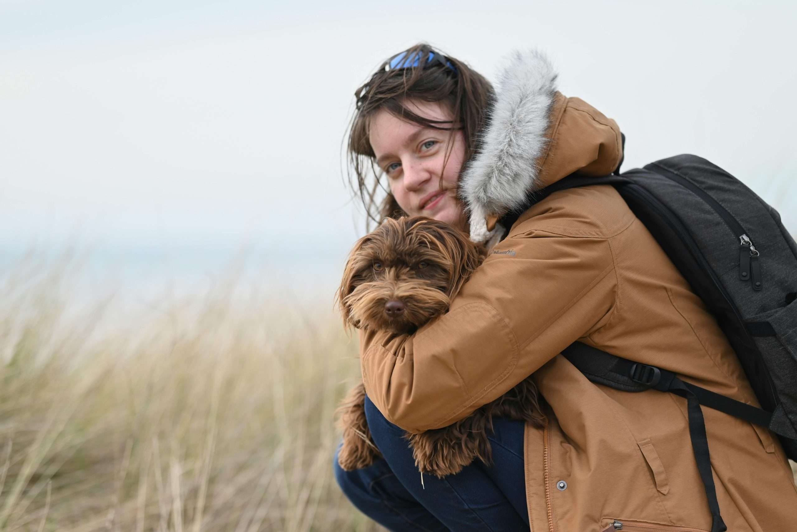 An image of a dog hugging its owner - dog's best friend